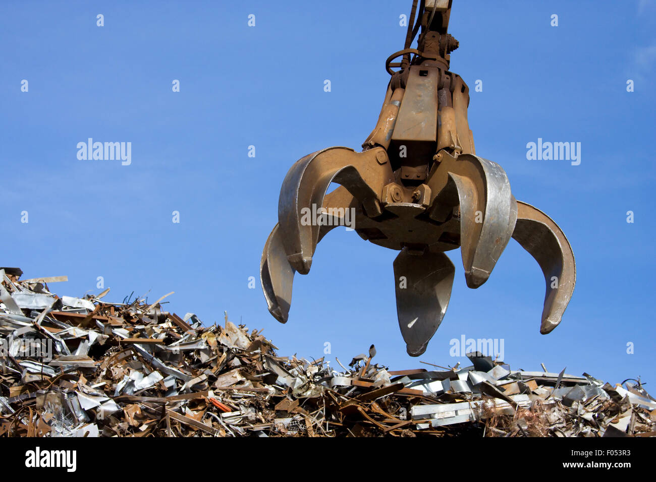 Crane grabber loading metal scrap Stock Photo