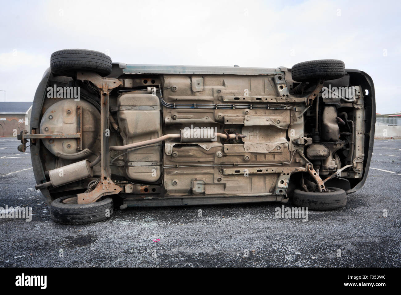 car bottom turned on the side after road collision Stock Photo