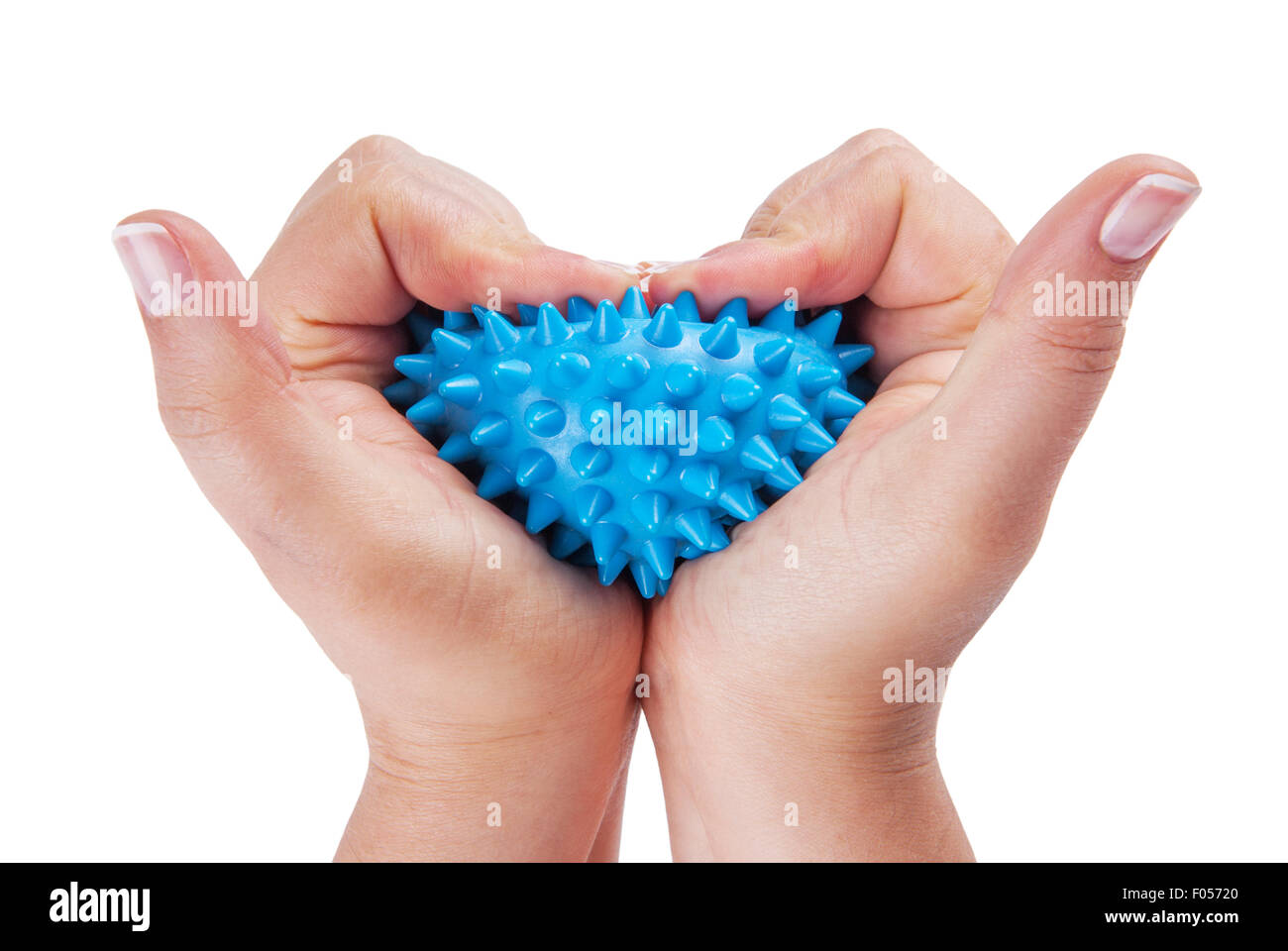 Womans hands with Spiny plastic blue massage ball isolated on white Stock Photo