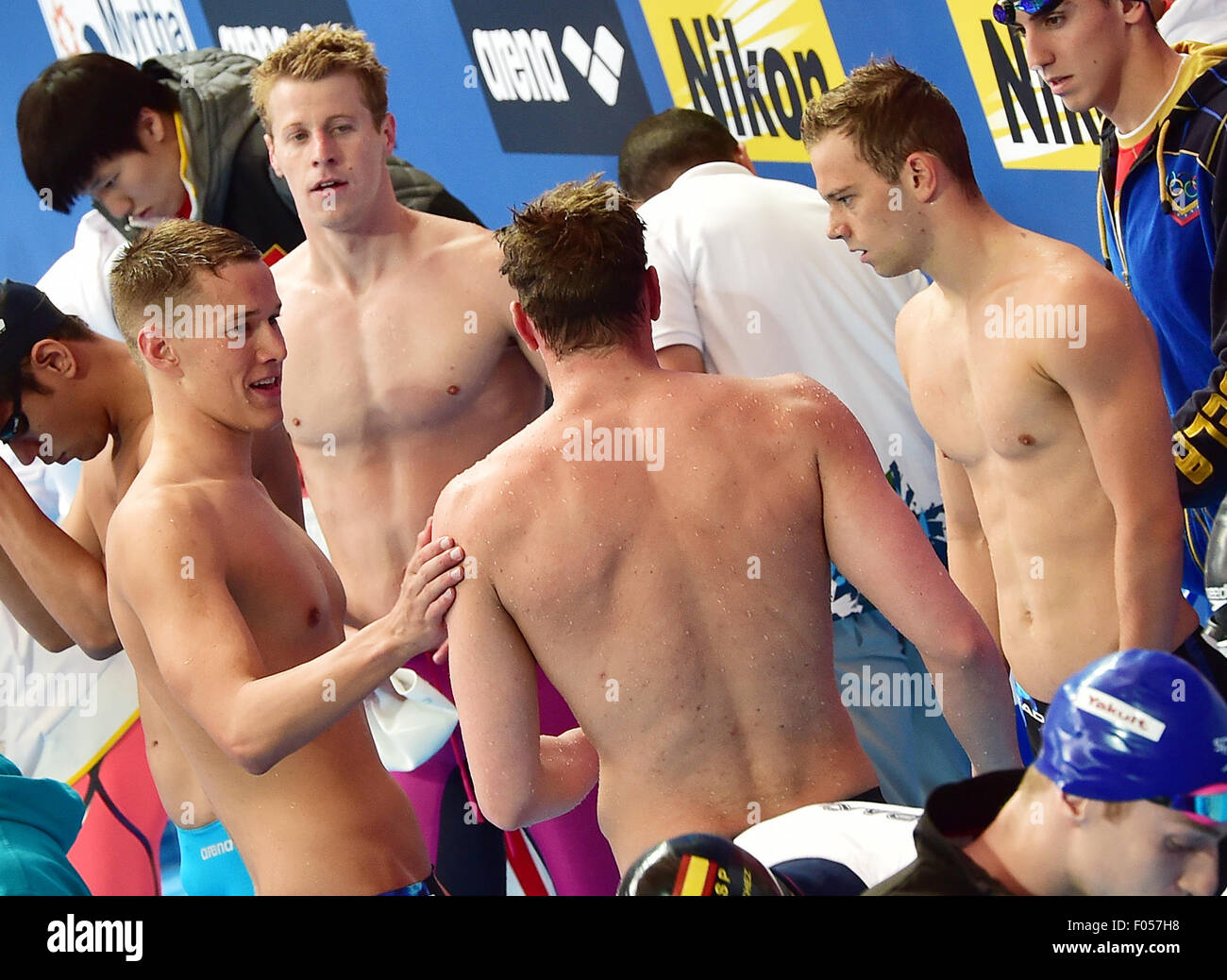 Kazan, Russia. 07th Aug, 2015. Jacob Heidtmann (L-R), Clemens Rapp, Paul Biedermann and Florian Vogel of Germany reacts after the Men's 4x200m Freestyle Heats of the 16th FINA Swimming World Championships at Kazan Arena in Kazan, Russia, 07 August 2015. Photo: Martin Schutt/dpa/Alamy Live News Stock Photo