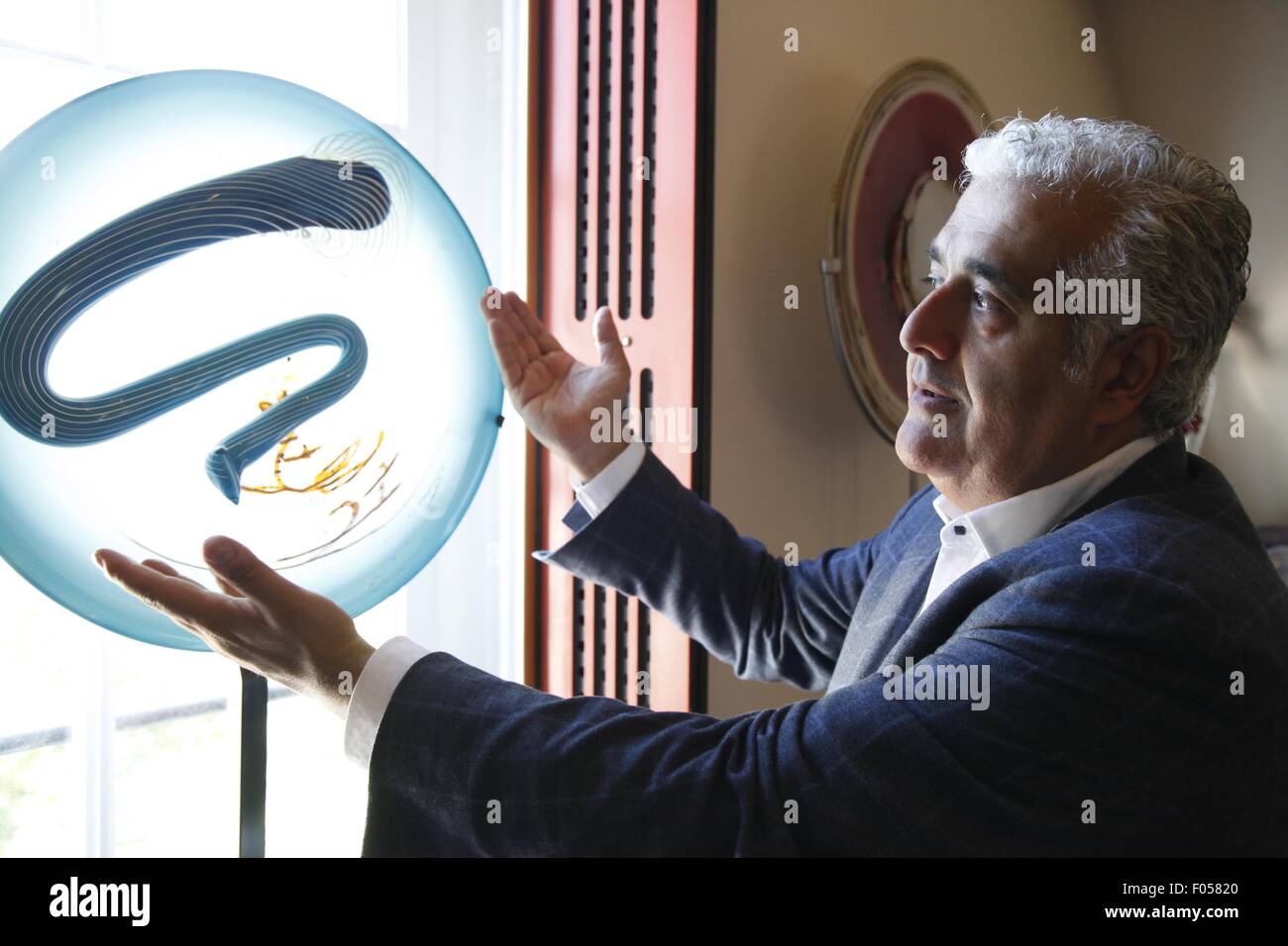 Brussels, Belgium. 06th Aug, 2015. Andon Akayyan shows his crystal ball collection on Aug. 6, 2015, Brussels, Belgium. Belgian Andon Akayyan is the world number one for his collection of crystal balls of stairs (Newel Post Finial). Crystal balls were ornaments in vogue in luxury residences from the 18th to 20th centuries. Credit:  Xinhua/Alamy Live News Stock Photo