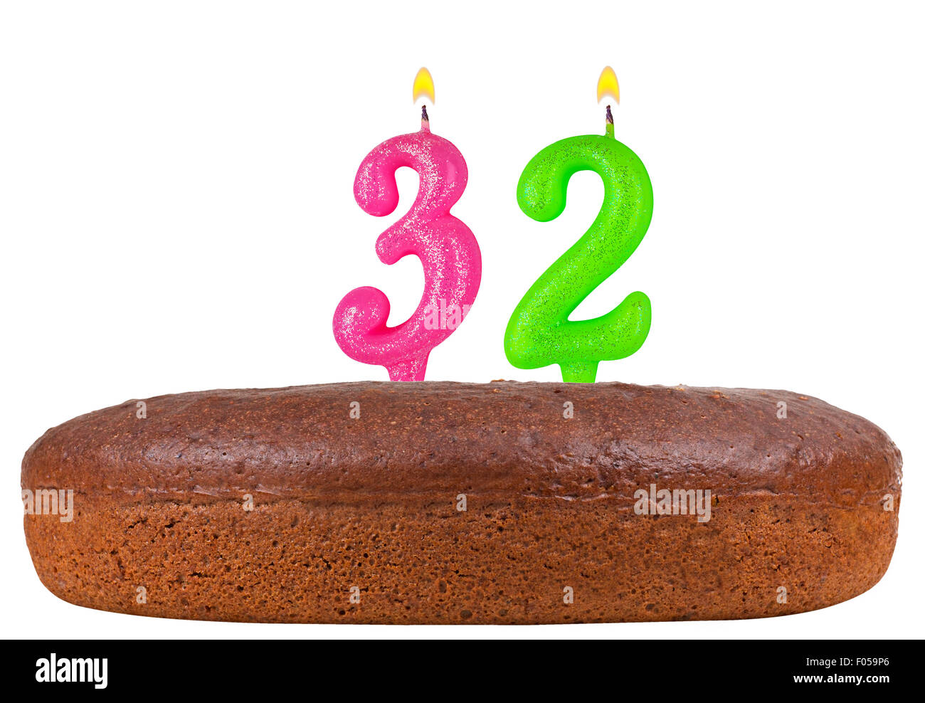 birthday cake with candles number 32 isolated on white background Stock