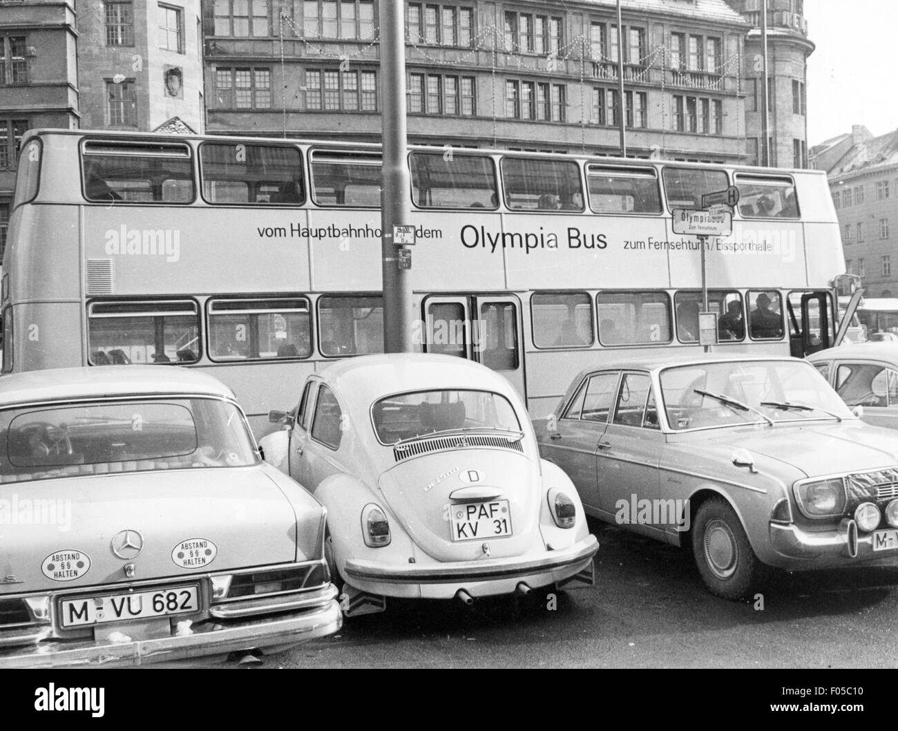 geography / travel,Germany,Munich,transport / transportation,public local traffic,Olympia Bus,direct connection from the Central Station to the Olympic Area,stop at Bahnhofsplatz,1970,double decker,double-decker bus,double deckers,double-decker buses,double-decker busses,public local traffic,bus stop,bus stops,tourism,touristic,cars,car,Volkswagen,VW beetle 1500,Mercedes-Benz W 110,Mercedes Benz W110,people,Bavaria,West Germany,Western Germany,Germany,1970s,70s,20th century,transport,transportation,connection,connexion,conne,Additional-Rights-Clearences-Not Available Stock Photo