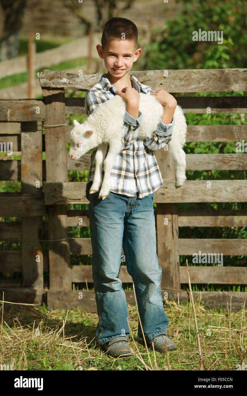 boy with lamb on the farm Stock Photo - Alamy