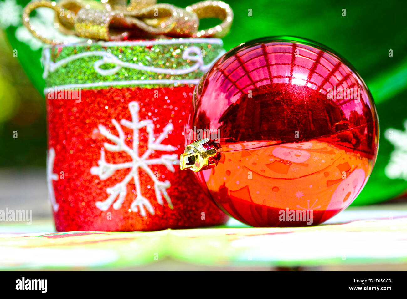 Red christmas ball together with other holiday decorations Stock Photo