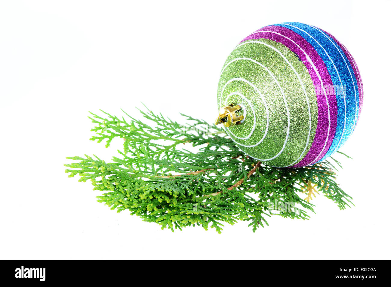 Christmas ball over pine leaves isolated on white Stock Photo