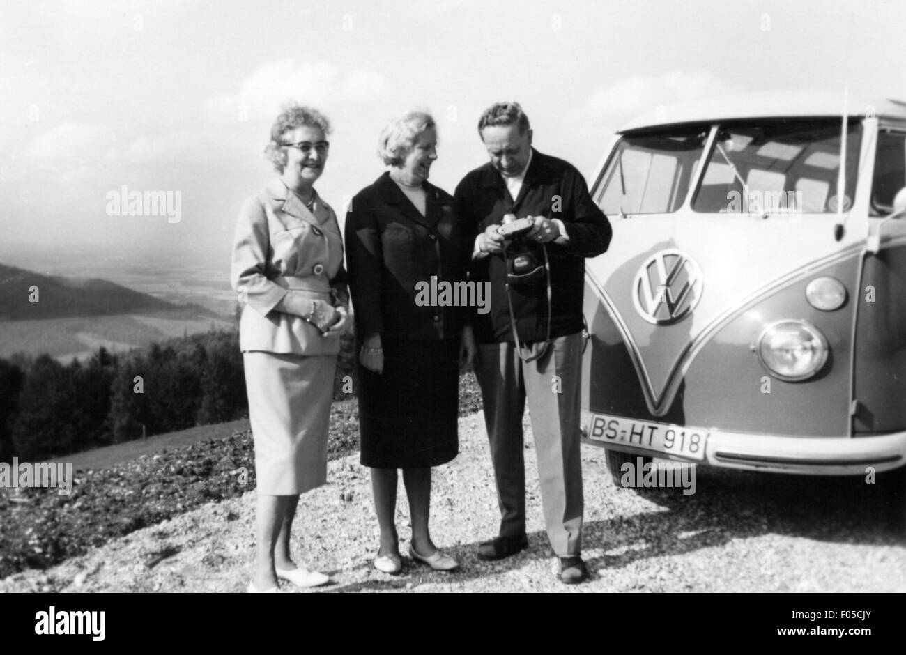 leisure time, excursion, three older people in front of VW T1 minibus having a photo break on a roadtrip, 1960s, Additional-Rights-Clearences-Not Available Stock Photo