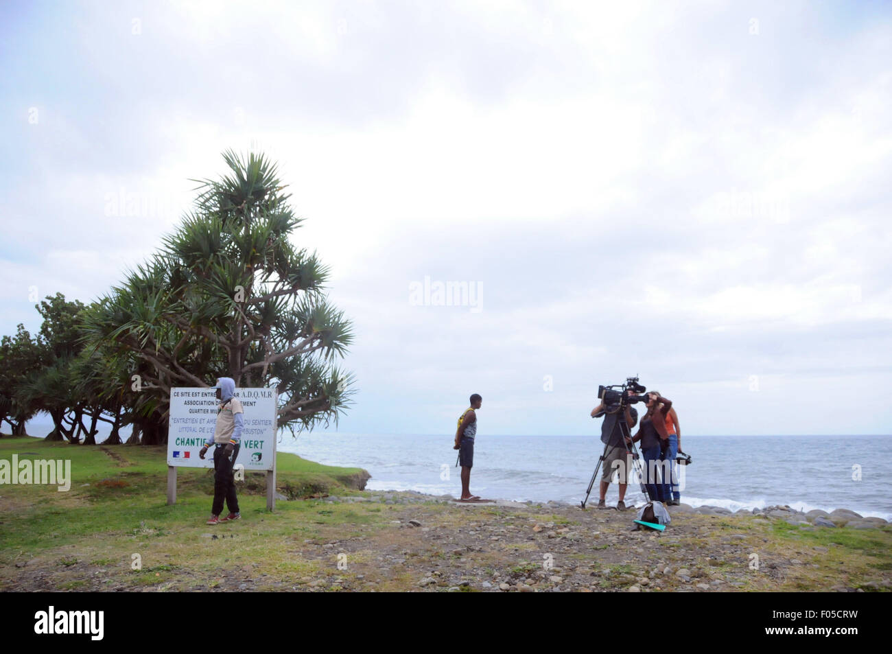 La Reunion. 7th Aug, 2015. Journalists do interviews at the Saint Andre beach, northeast of France's oversea island La Reunion. Authority of France's oversea island La Reunion has confirmed the plan of search for more MH370 parts and said the search will last for at least one week. Credit:  Zhang Chuanshi/Xinhua/Alamy Live News Stock Photo