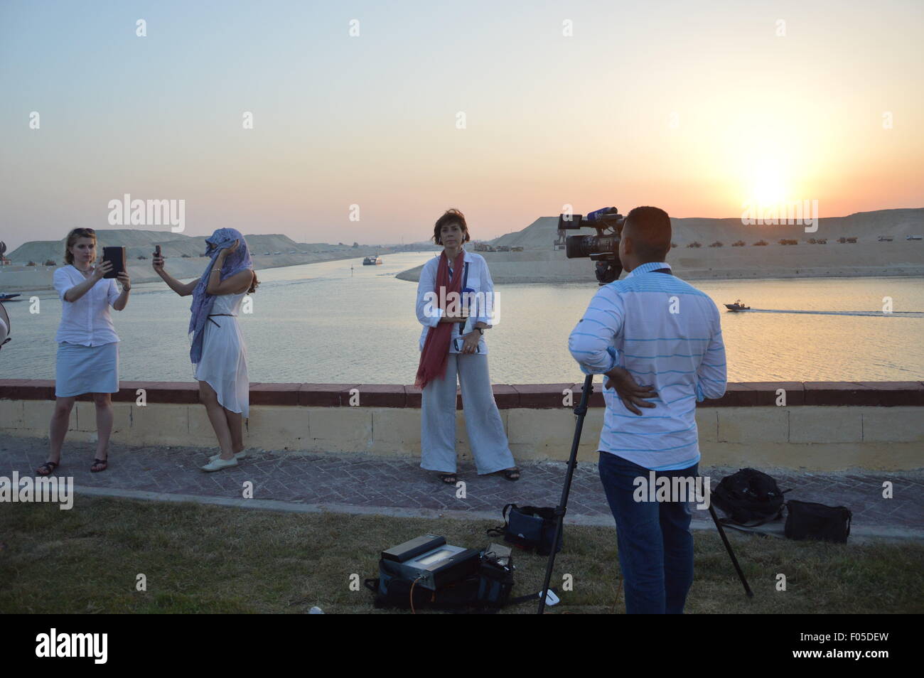Cairo, Egypt. 6th Aug, 2015. International media and selfie takers at the inauguration of the new Suez Canal upgrade, completed after 1 year of non-stop 24/7 work, aiming to increase shipping capacity from from 49 to 97 ships per day, and decreasing waiting times from 24 to 11 hours. Credit:  Barry Iverson/Alamy Live News Stock Photo