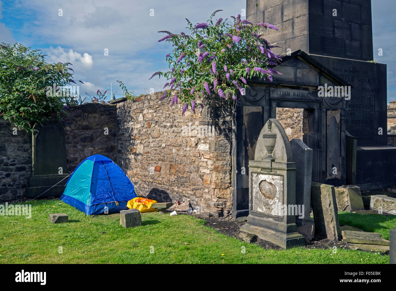 Not everyone's ideal spot to pitch a tent - in Old Calton Burial Ground in the centre of Edinburgh, Scotland, UK. Stock Photo