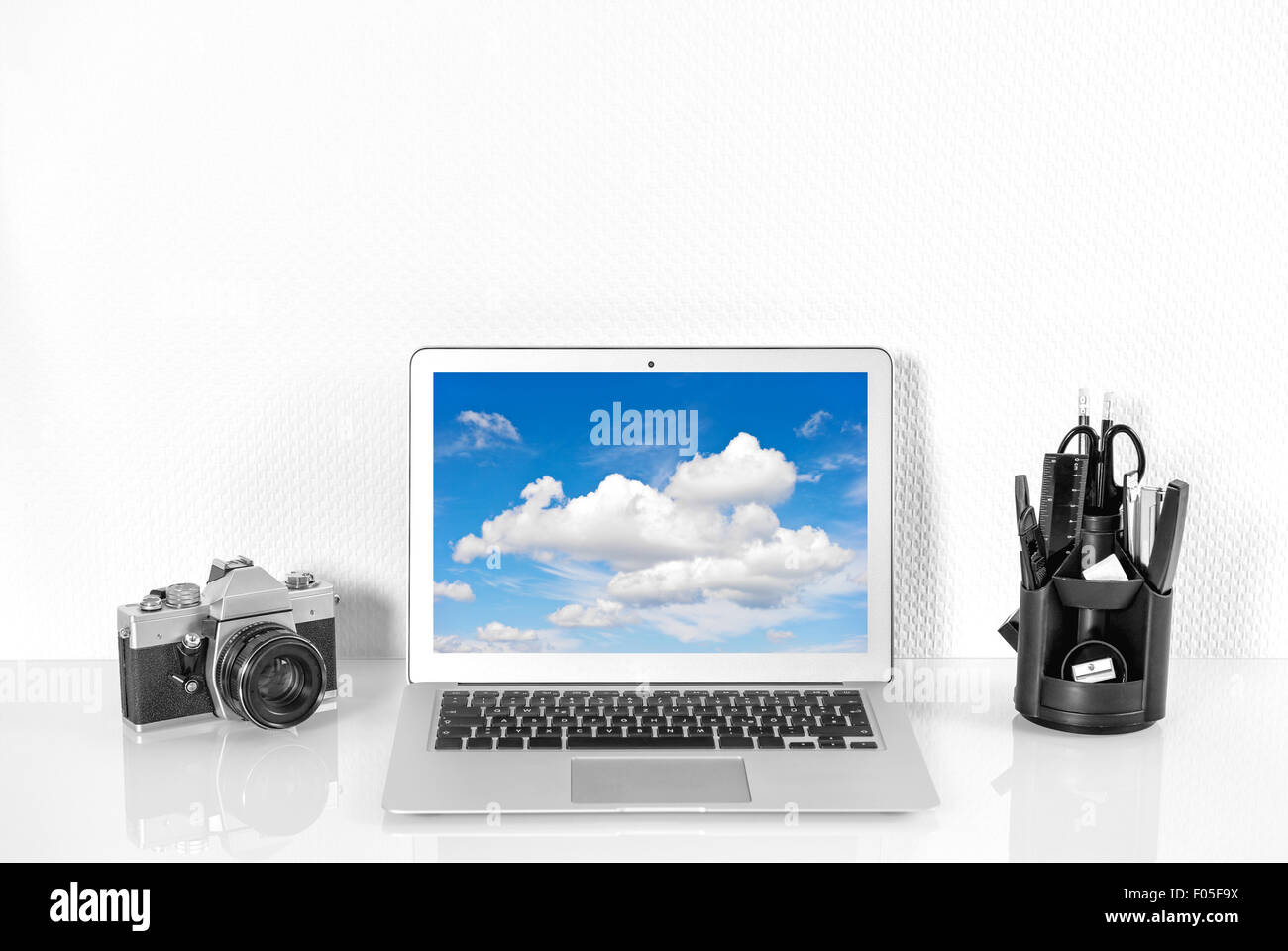Working station with office supplies and analoge vintage Camera.  Workplace Mock Up with product display Stock Photo