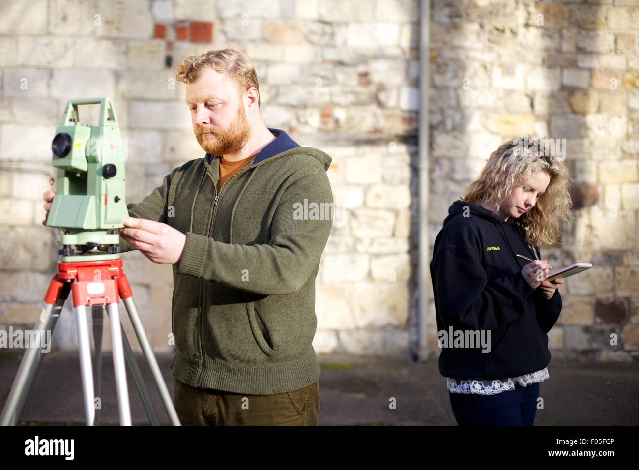 archaeology students with mapping device Stock Photo