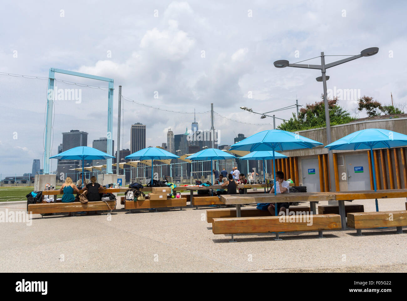 Dumbo summer holiday picnic tables town people enjoying outdoor cafes