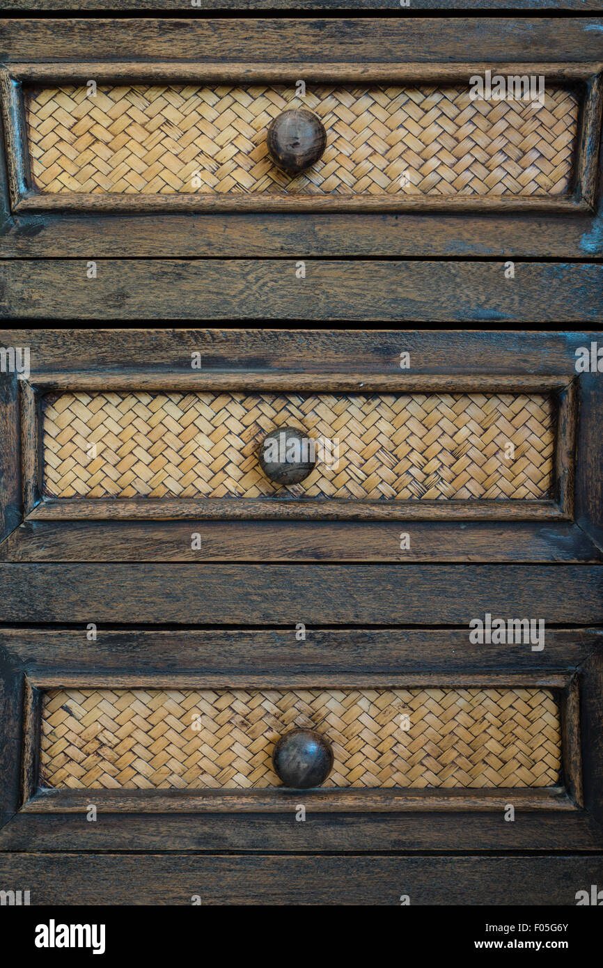 Old wood drawer with bamboo weave patterns Stock Photo