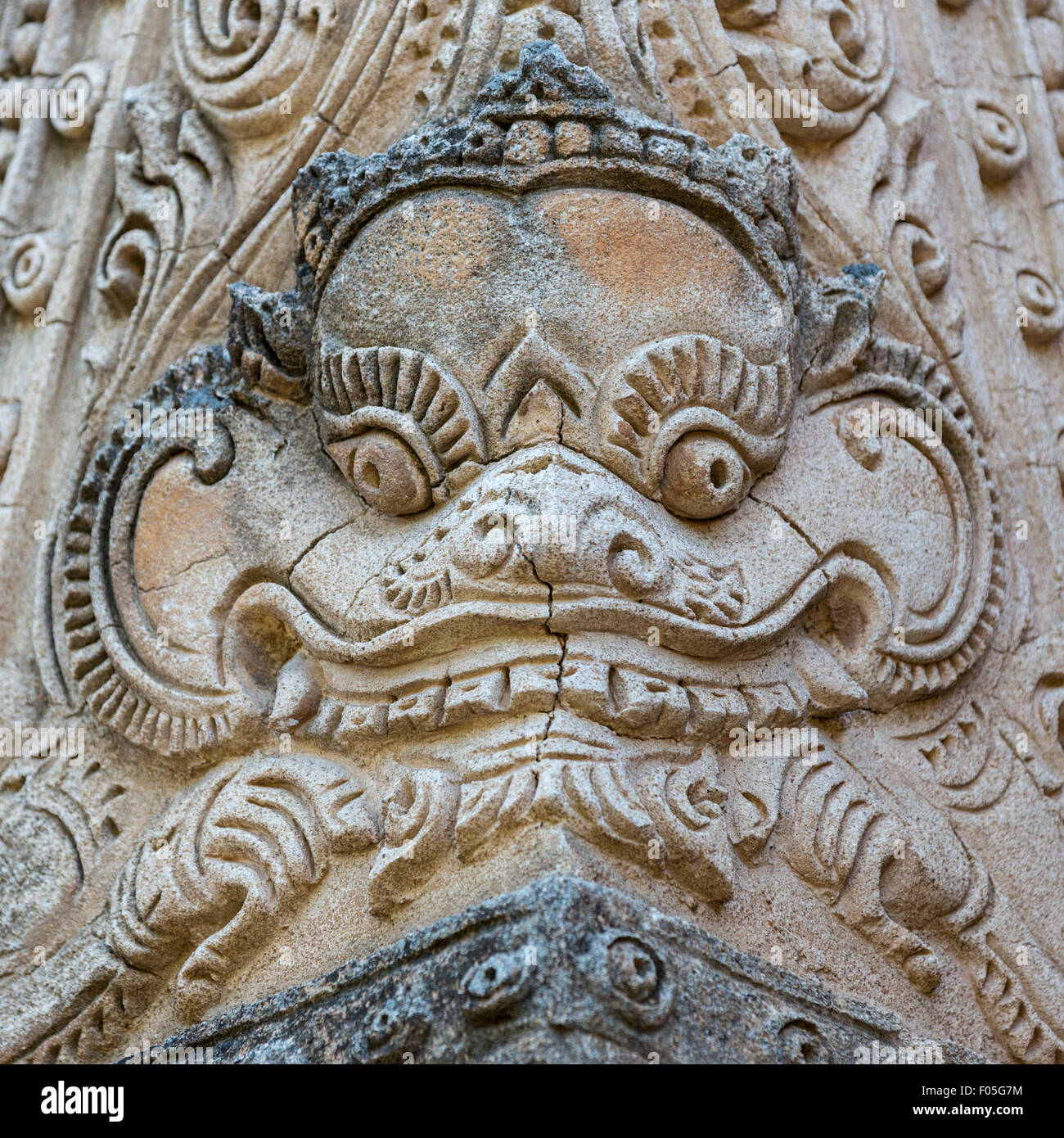 Corner stone carving of ogre at 13th century Htilominlo Paya, Bagan, Myanmar Stock Photo