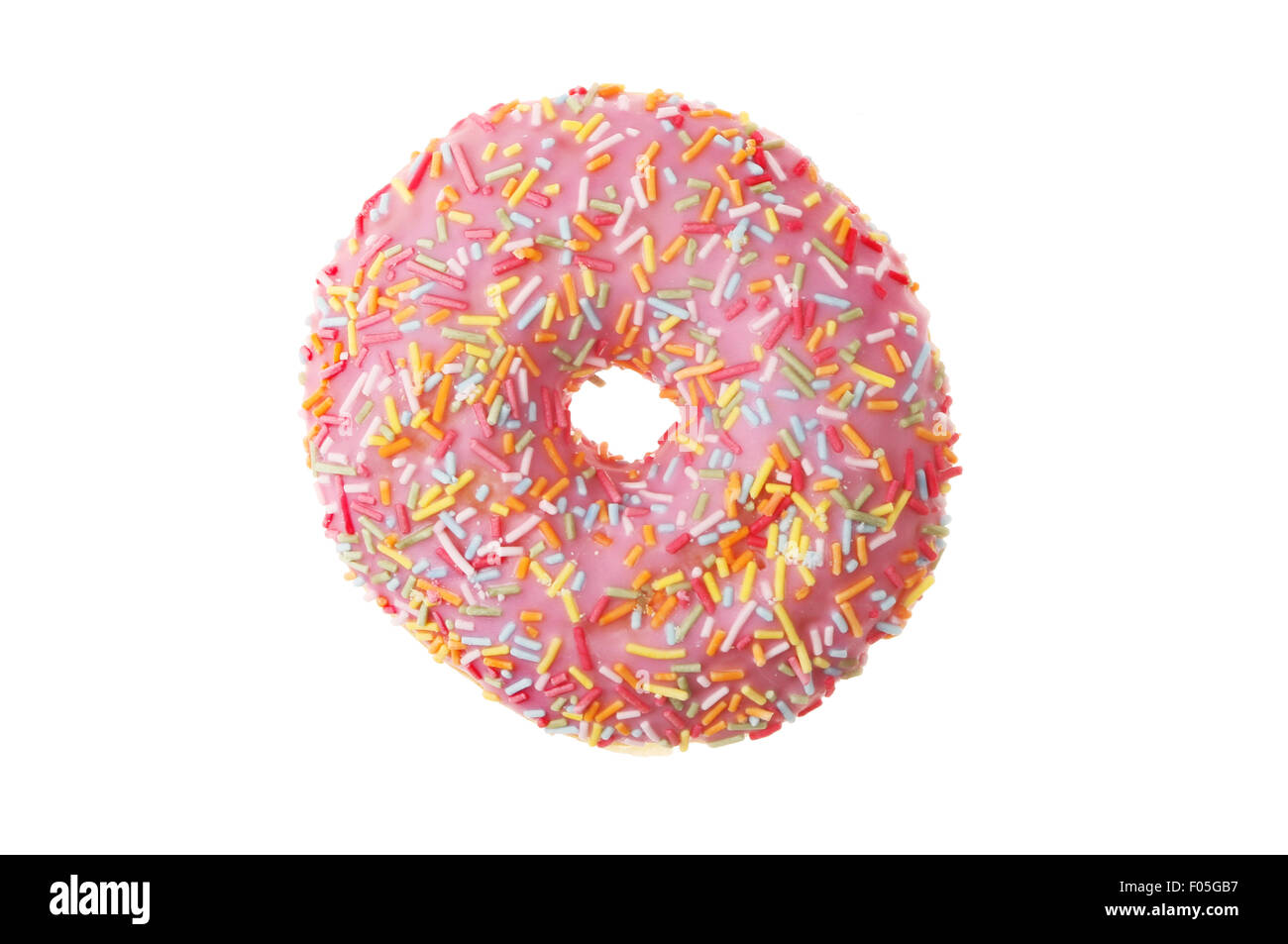 Iced ring donut with hundreds and thousands isolated against white Stock Photo