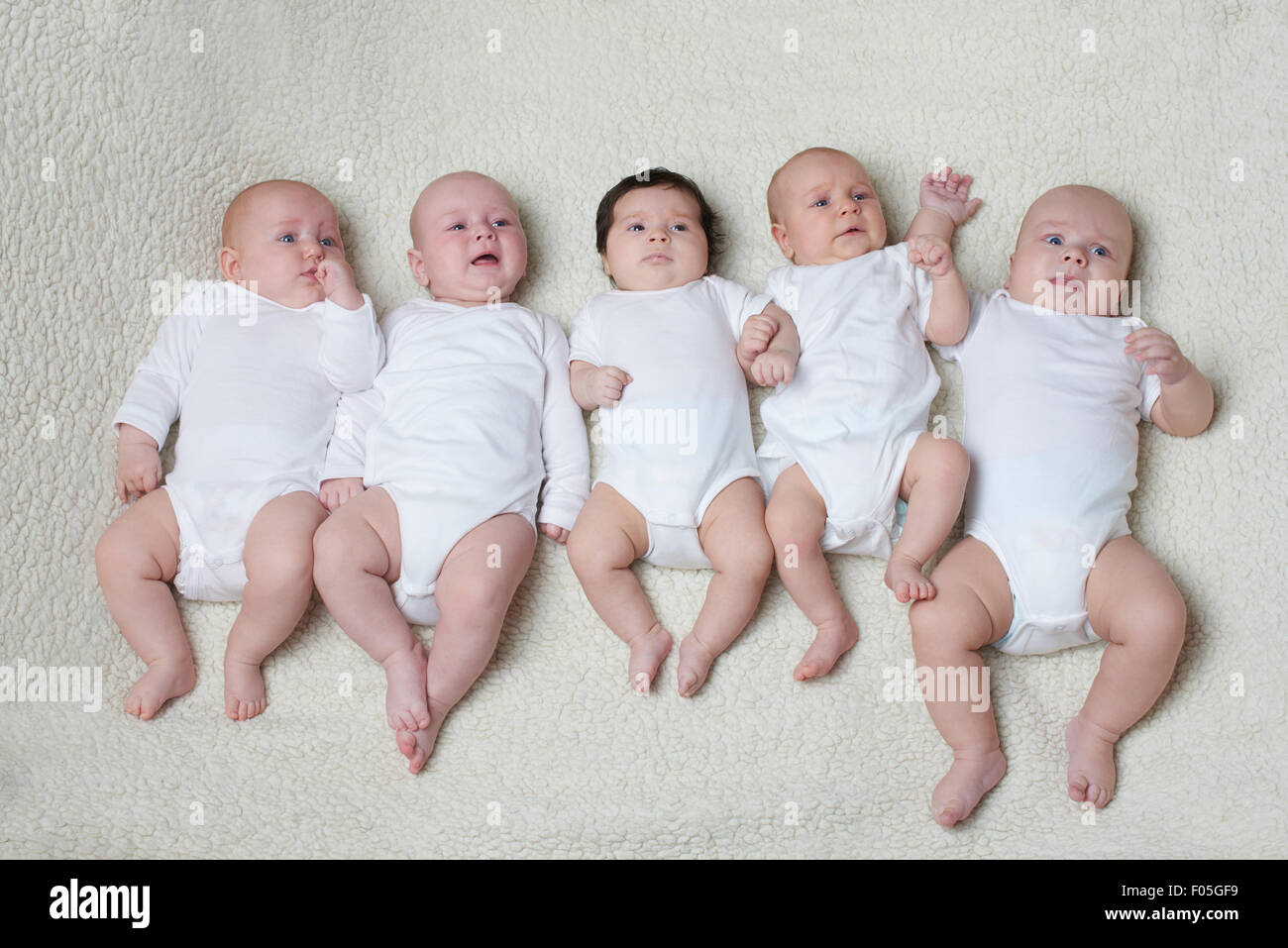 cute babies on light background Stock Photo