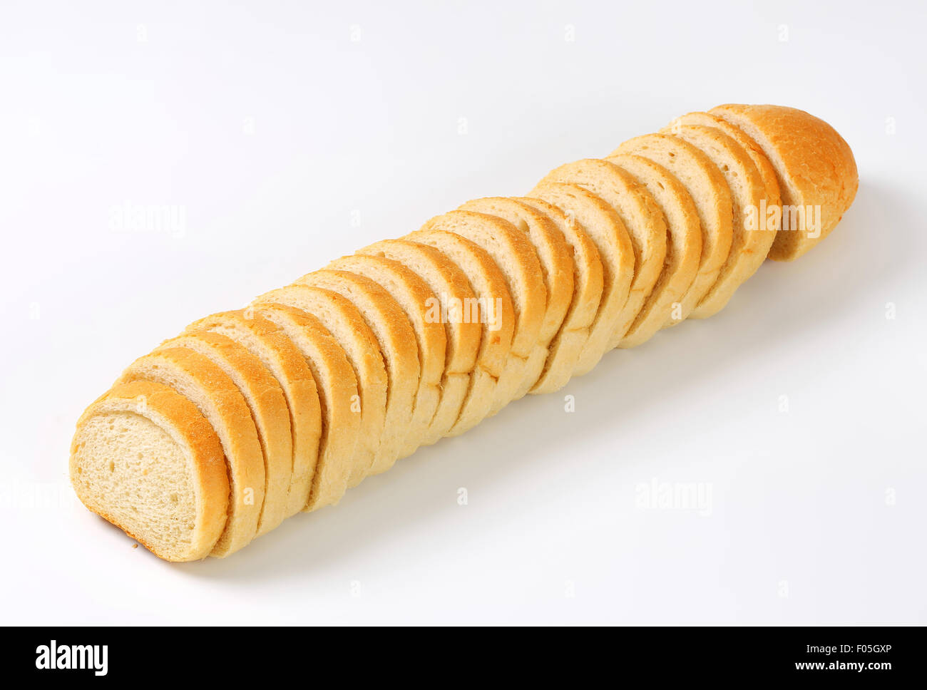 Long loaf of white bread sliced Stock Photo Alamy