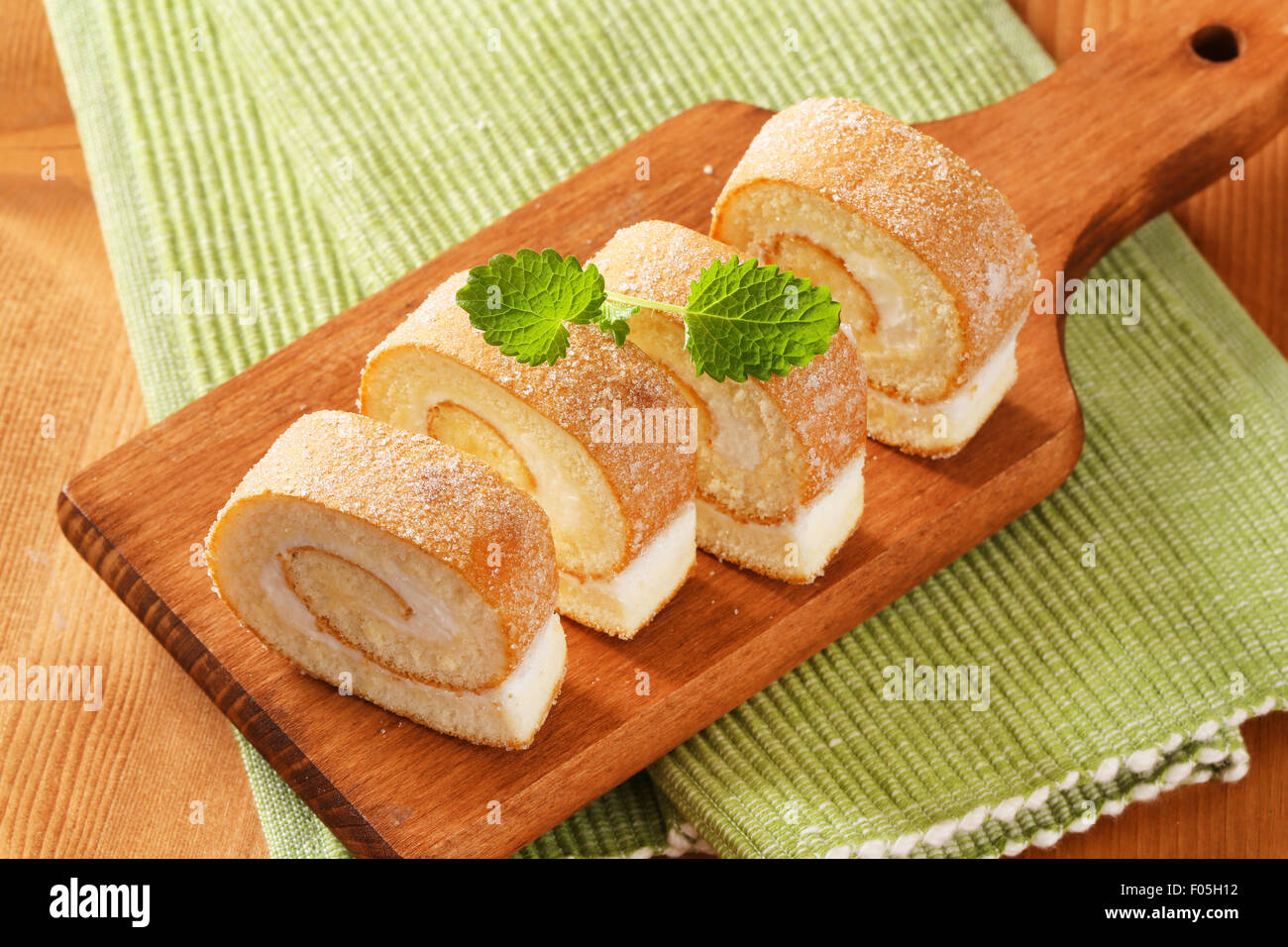 Sponge cake roll with cream filling Stock Photo Alamy
