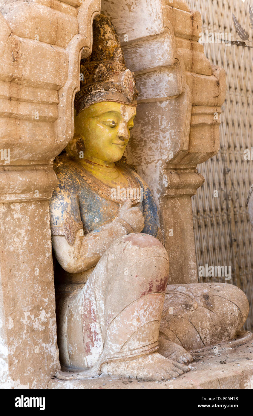 Statue with remnants of original painted colors at Ananda Paya, Bagan ...