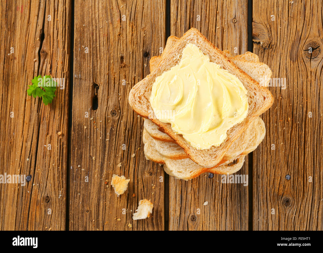 https://c8.alamy.com/comp/F05HT1/slices-of-sandwich-bread-and-butter-F05HT1.jpg