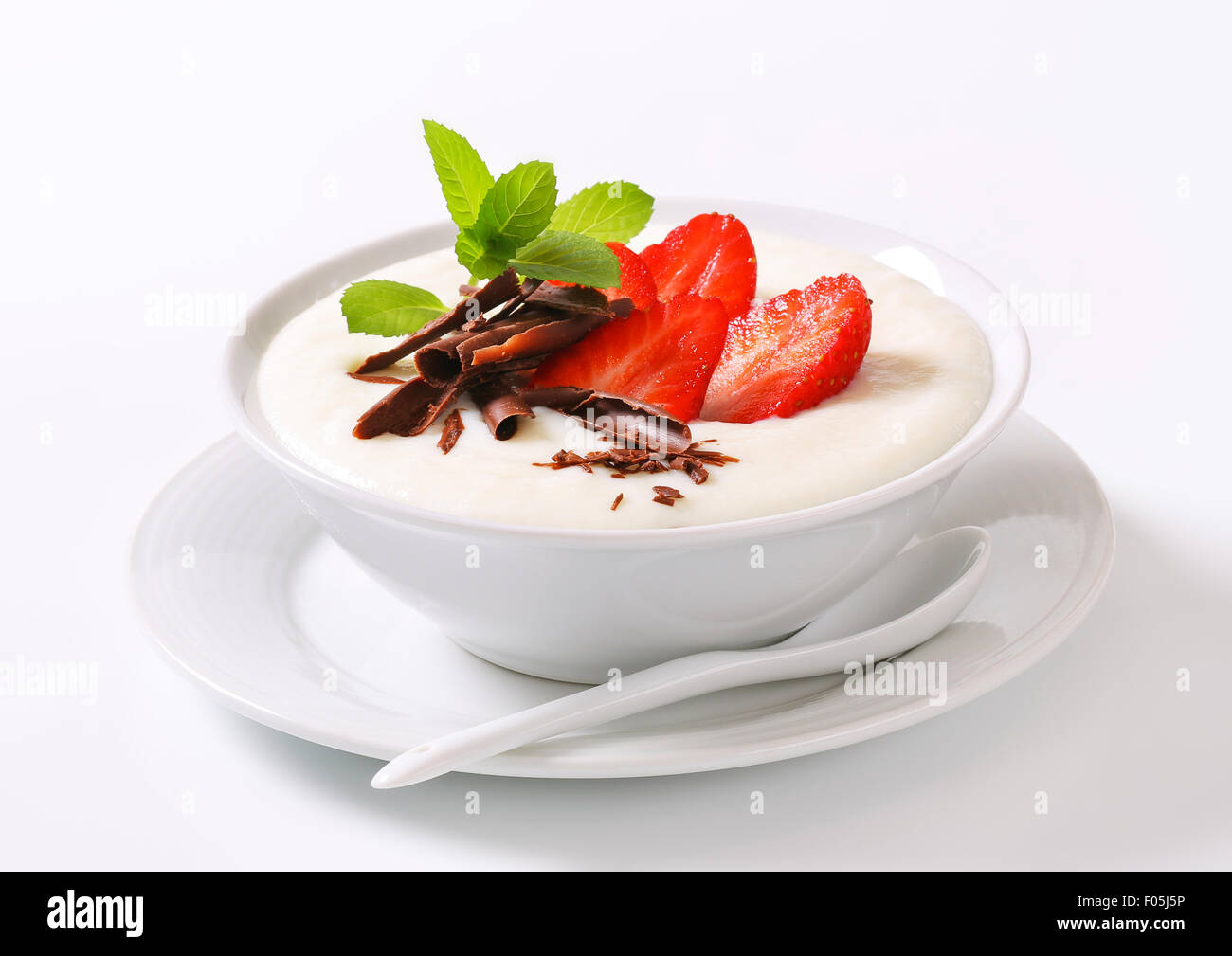 Bowl of semolina pudding with fresh strawberries Stock Photo