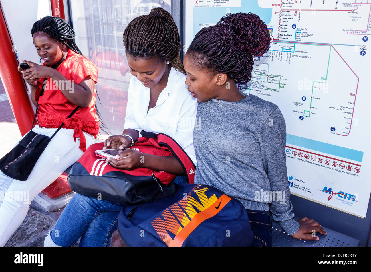 Cape Town South Africa,City Centre,center,Buitenkant Street,MyCiTi Bus stop,Black Afro American,girl girls,youngster,female kids children children,wom Stock Photo