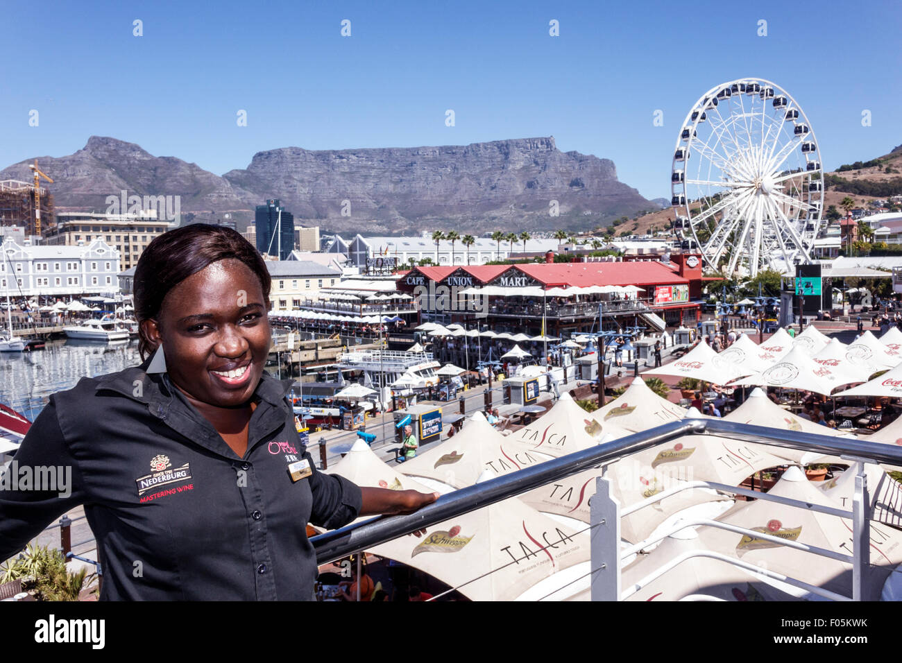 Cape Town South Africa,V & A Victoria Alfred Waterfront,Table Bay Harbour,harbor,Table Mountain,Cape Wheel,Ferris,Cape Union Mart,Black Afro American, Stock Photo