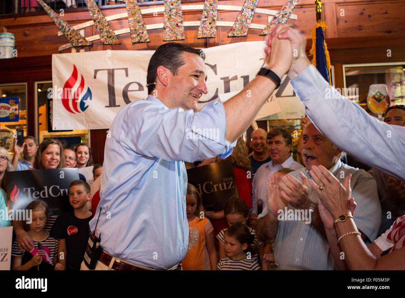 Mt Pleasant, South Carolina, USA. 7th Aug, 2015. U.S. Senator and GOP presidential candidate Ted Cruz high fives a supporter during a campaign stop at the Liberty Tap Room restaurant August 7, 2015 in Mt Pleasant, South Carolina. The event was the kick off for a seven-day bus tour called the Cruz Country Bus Tour of southern states. Credit:  Planetpix/Alamy Live News Stock Photo