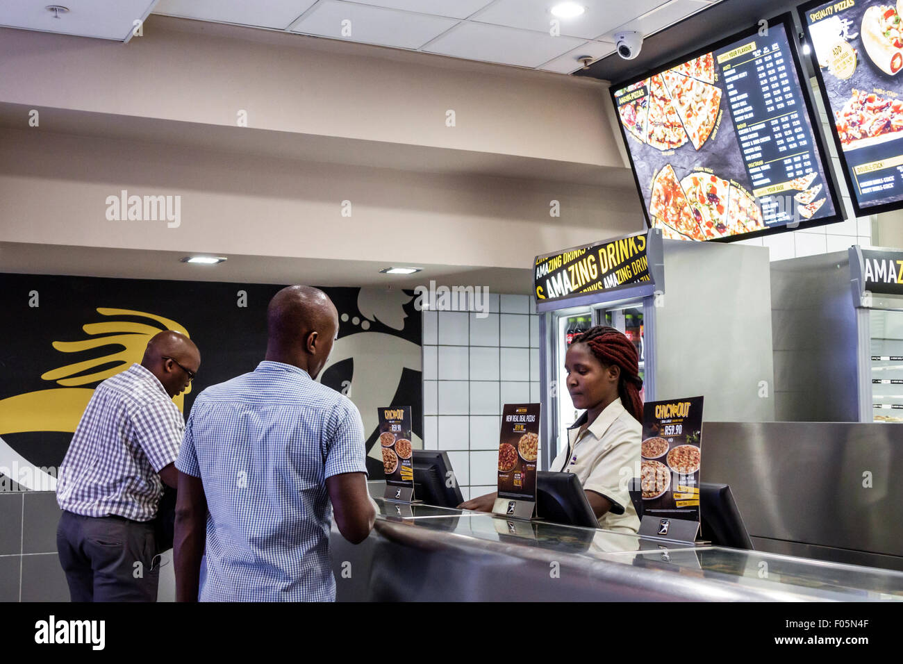 Cape Town South Africa,City Centre,center,Debonairs Pizza,fast food,interior inside,counter,Black Afro American,woman female women,working work worker Stock Photo