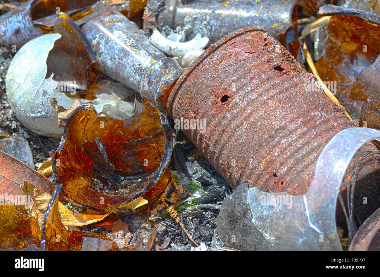 Macro shot of a pile of broken glass and debris that has been burned in a garbage dump Stock Photo