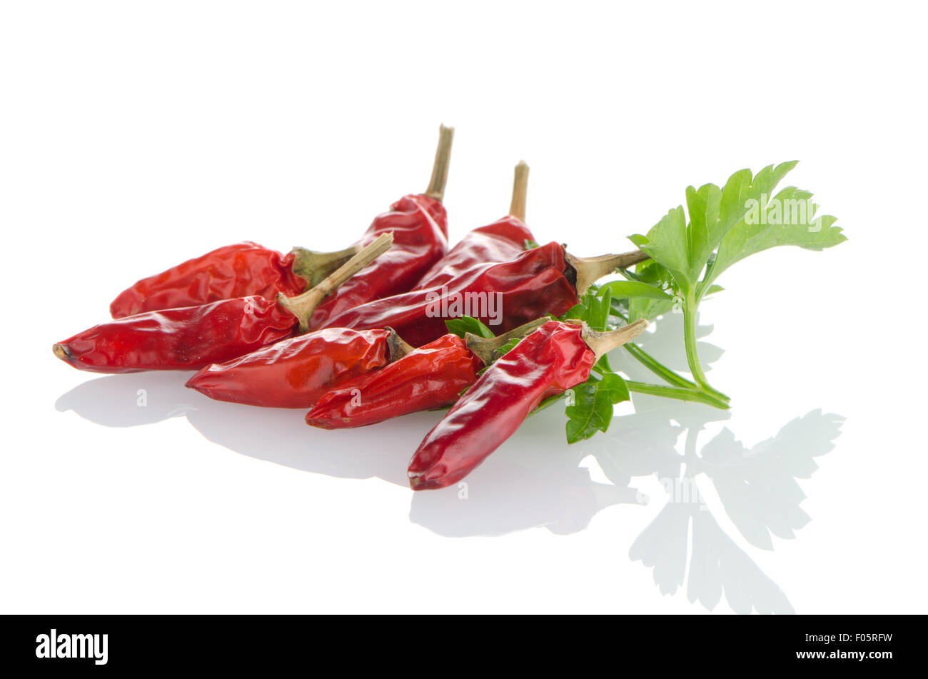 Red chili peppers on a white background Stock Photo - Alamy