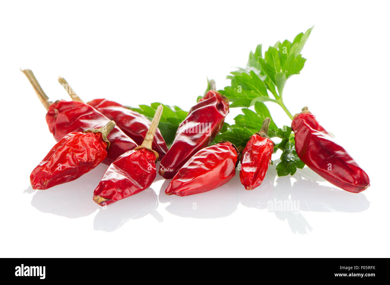 Red chili peppers on a white background Stock Photo - Alamy