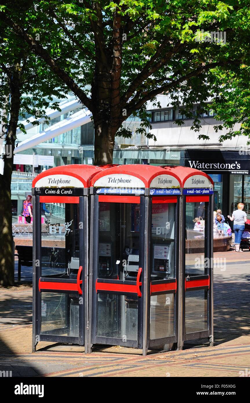 Bank of telephone boxes outside the Lower Precinct Shopping Centre in the city centre, Coventry, West Midlands, England, UK. Stock Photo