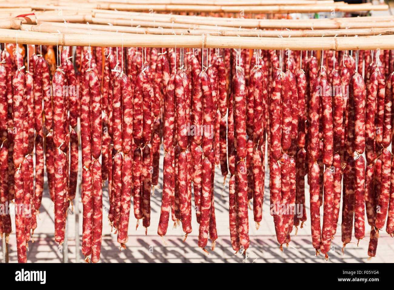 Drying Chinese sausage under the Sun Stock Photo