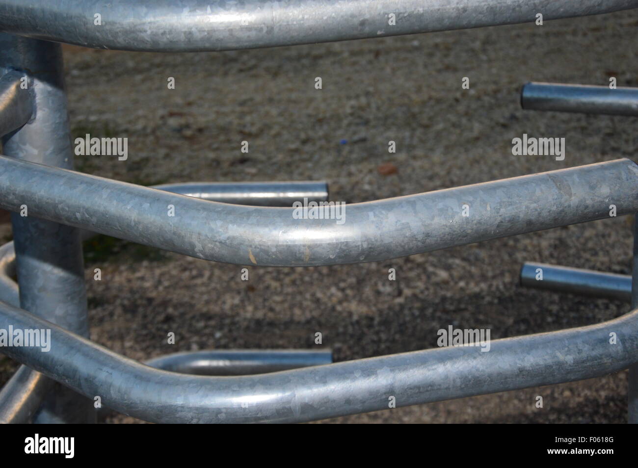 Arched metal pipes installation for a public place entrance. Stock Photo