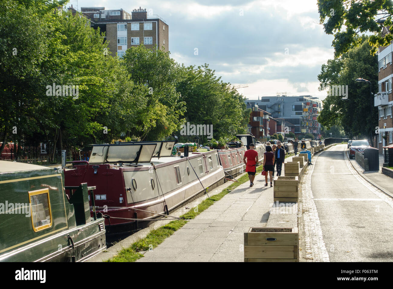 People spending a sunny weekend day in summer 2015 by a canal in East London. Stock Photo