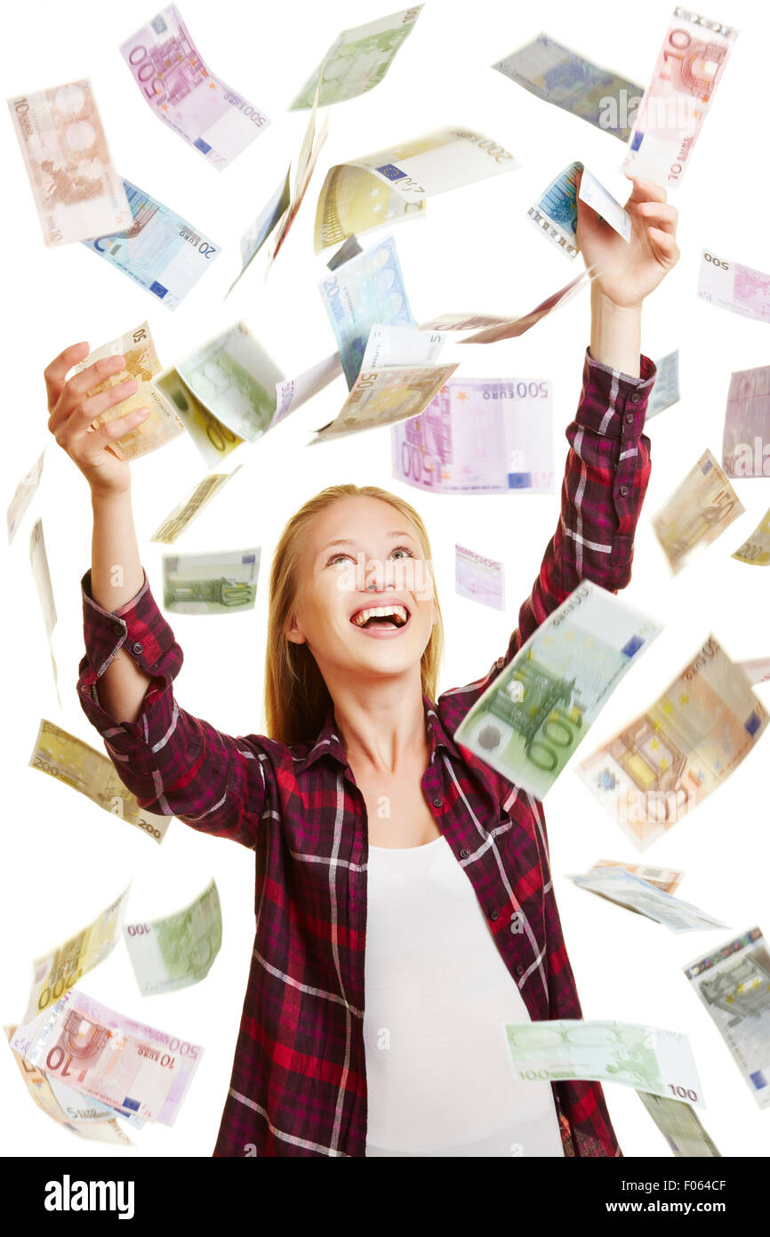 Young lucky woman catching money in rain of Euro bills Stock Photo