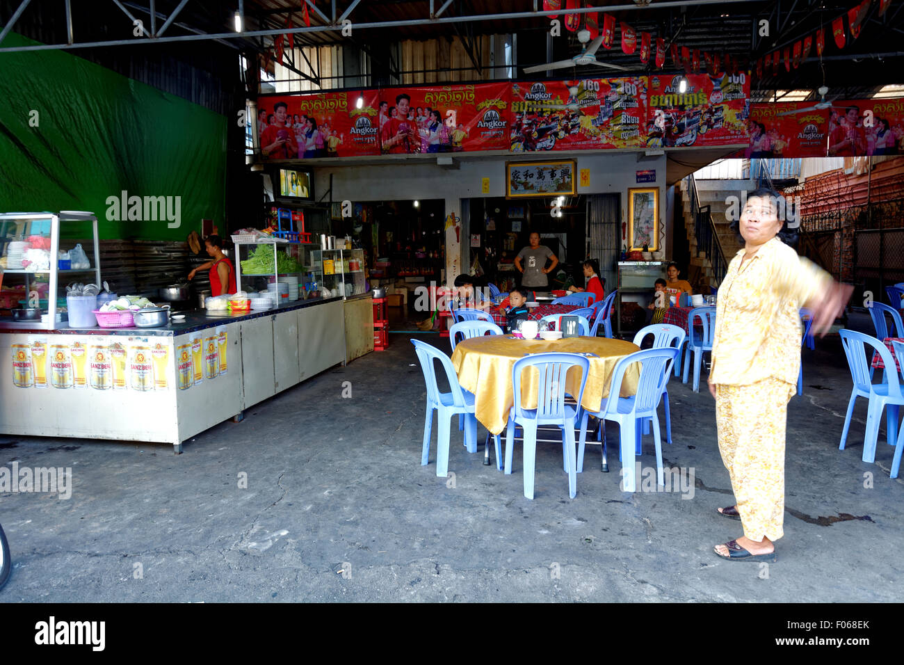 restaurant, Sihanoukville, Cambodia, cook, children, Far East, beer, open air food stall, locals, Khmer eating Stock Photo