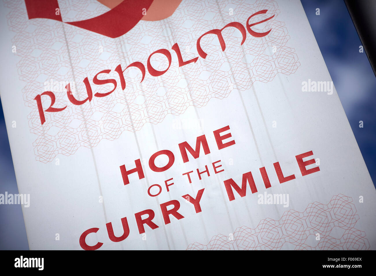 Rusholme A34 curry mile in Manchester Uk   First bus 42 route  cycling on road bike cyclist Shop shopping shopper store retail s Stock Photo