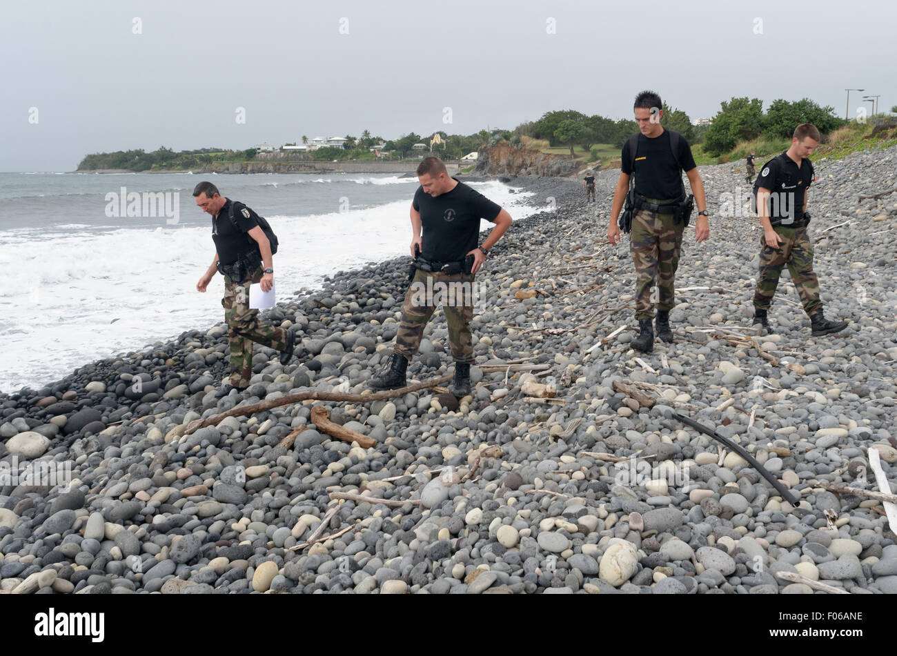 Sainte-Marie, Reunion island, France. 8th Aug, 2015. Yesterday and today, the first foot patrols of the Gendarmerie squad of Reunion were deployed all along the shoreline to the east coast, between Sainte-Marie and Sainte-Suzanne, to check for aircraft debris from the trash on the shore Credit:  Valerie Koch/ZUMA Wire/Alamy Live News Stock Photo