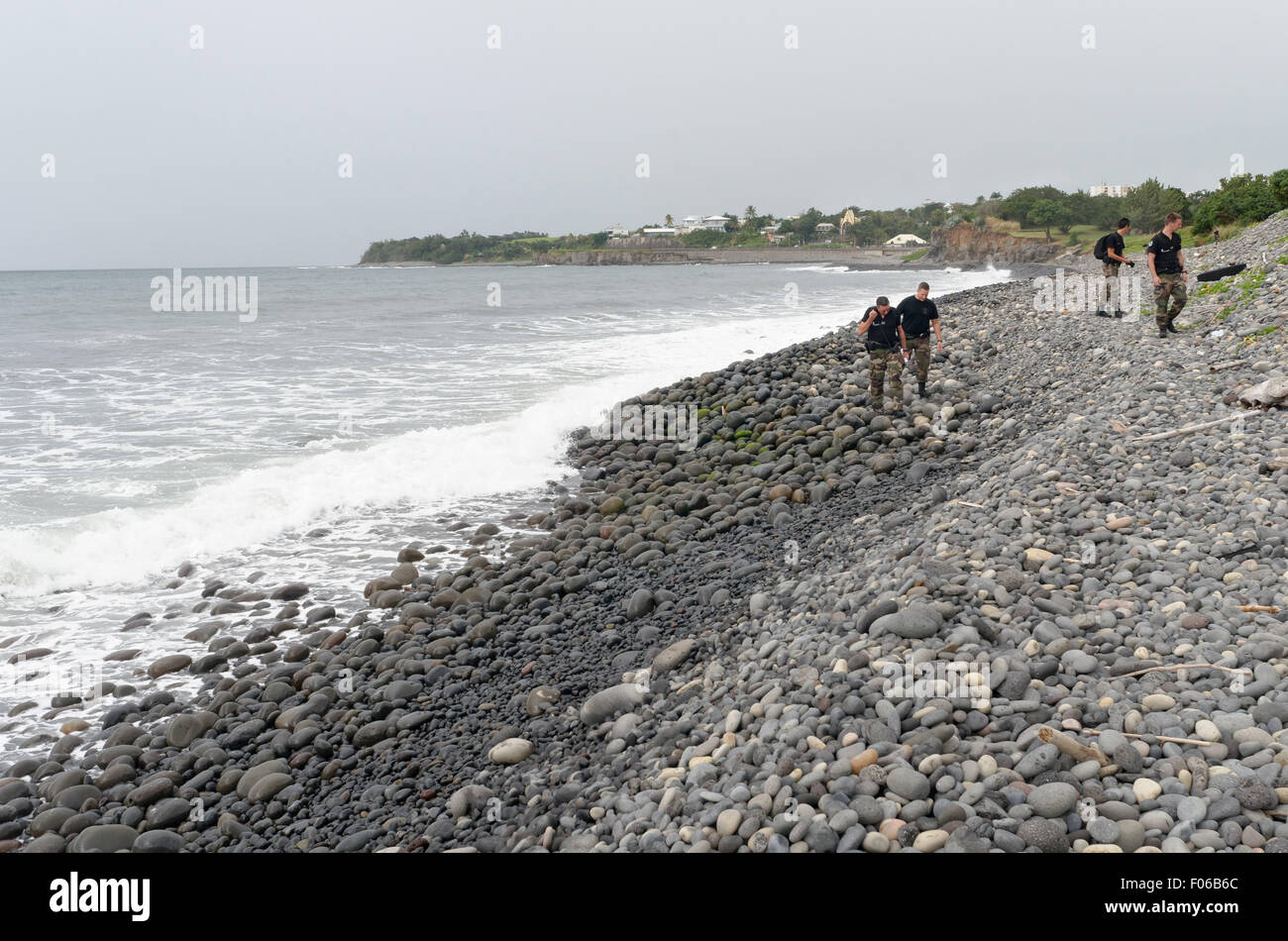 Sainte-Marie, Reunion island, France. 8th Aug, 2015. Yesterday and today, the first foot patrols of the Gendarmerie squad of Reunion were deployed all along the shoreline to the east coast, between Sainte-Marie and Saint-Benoit, to check for aircraft debris from the trash on the shore Credit:  Valerie Koch/ZUMA Wire/Alamy Live News Stock Photo