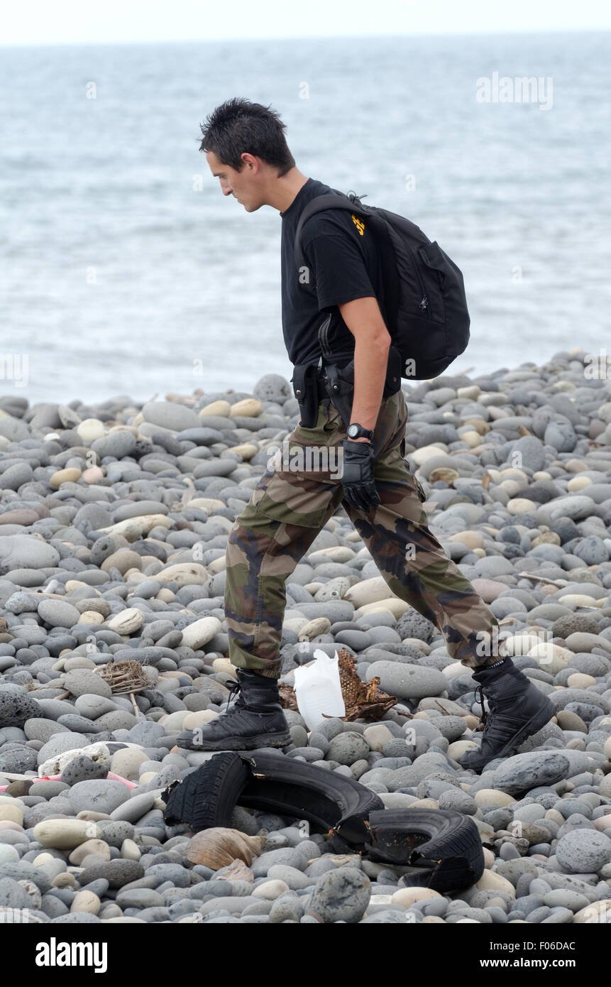 Sainte-Marie, Reunion island, France. 8th Aug, 2015. Yesterday and today, the first foot patrols of the Gendarmerie squad of Reunion were deployed all along the shoreline to the east coast, between Sainte-Marie and Saint-Benoit, to check for aircraft debris from the trash on the shore Credit:  Valerie Koch/ZUMA Wire/Alamy Live News Stock Photo