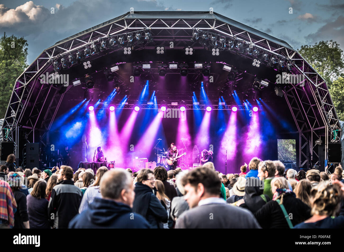 The Magic Numbers performing on stage under colourful lights at Larmer