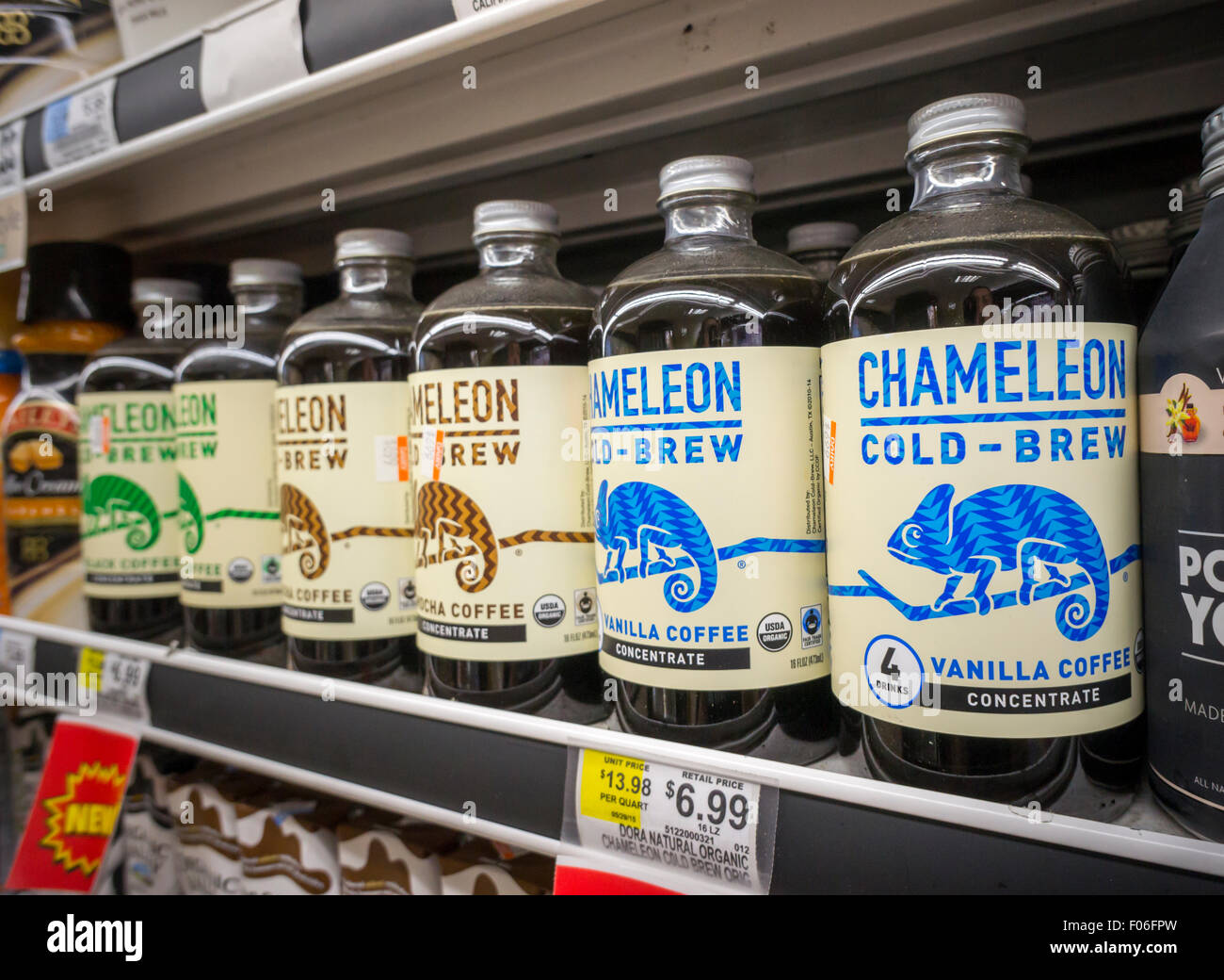 Bottles of Chameleon brand cold brewed coffee in a supermarket cooler in New York on Monday, August 3, 2015. As cold brewed coffee moves away from its hipster roots into the mainstream it is being offered by more and more coffee chains. It can also boost summer coffee sales, traditionally coffee drinking falls off in the hot months.  (© Richard B. Levine) Stock Photo