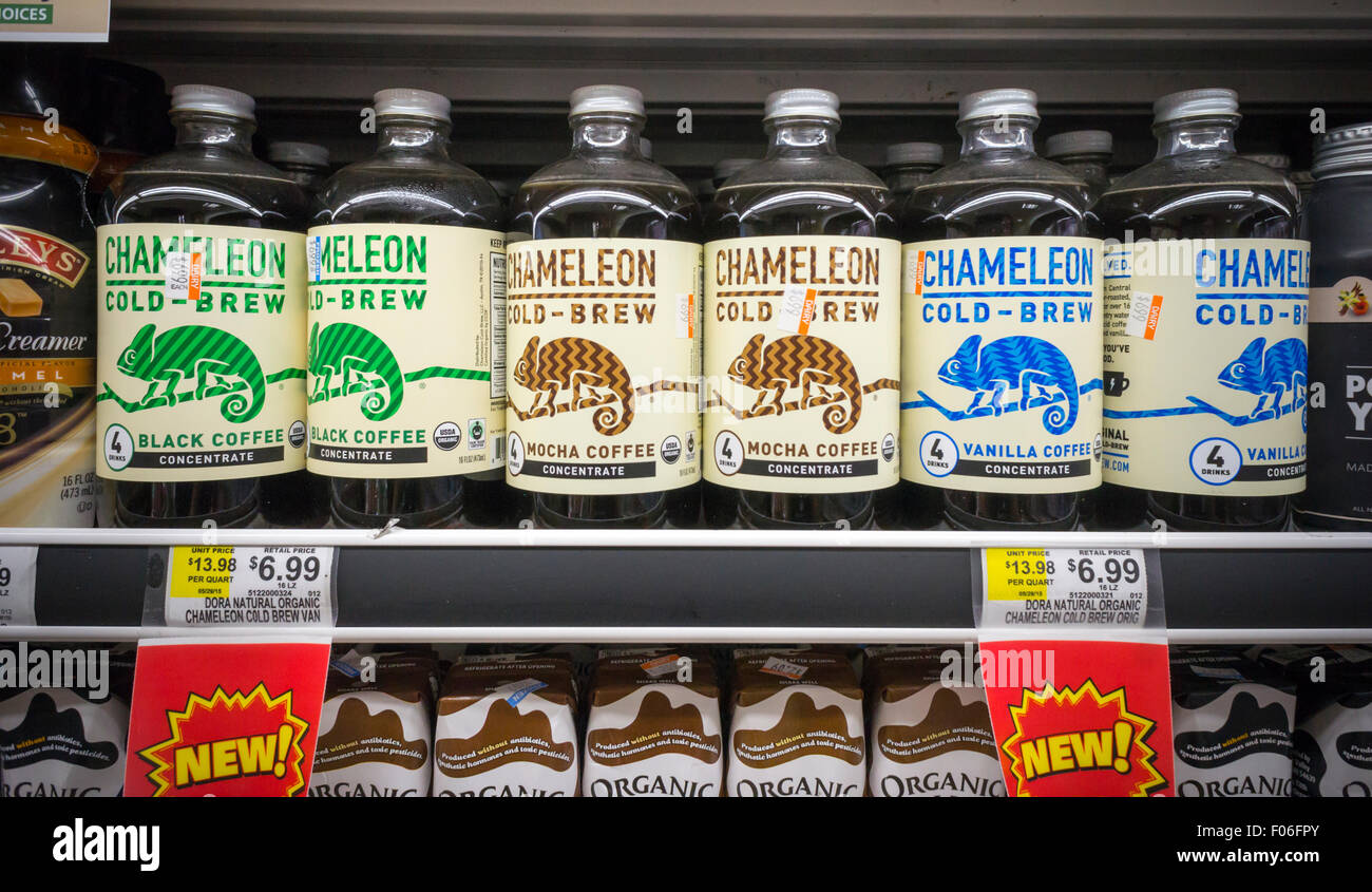 Bottles of Chameleon brand cold brewed coffee in a supermarket cooler in New York on Monday, August 3, 2015. As cold brewed coffee moves away from its hipster roots into the mainstream it is being offered by more and more coffee chains. It can also boost summer coffee sales, traditionally coffee drinking falls off in the hot months.  (© Richard B. Levine) Stock Photo