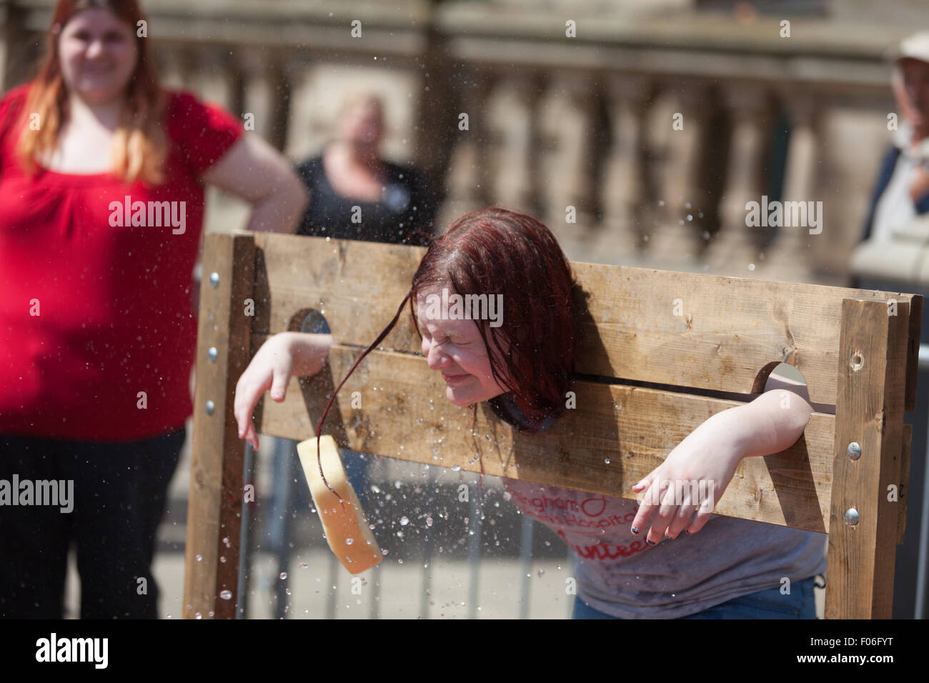 Birmingham, West Midlands, UK. 8th August, 2015. It was not all blood and gore. Raising money in the stocks with wet sponge throwing.  Credit:  Chris Gibson/Alamy Live News. Stock Photo