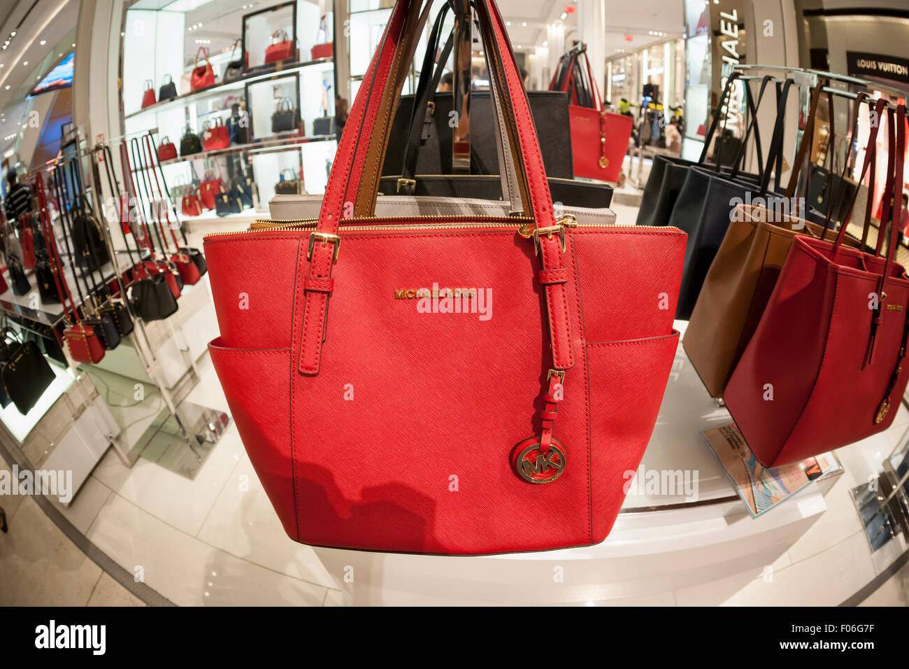 Handbags on display at the Michael Kors boutique within Macy's in New York  on Tuesday, August 4, 2015. First-quarter sales and profits for Michael  Kors handbag designer beat analysts' expectations, albeit low,