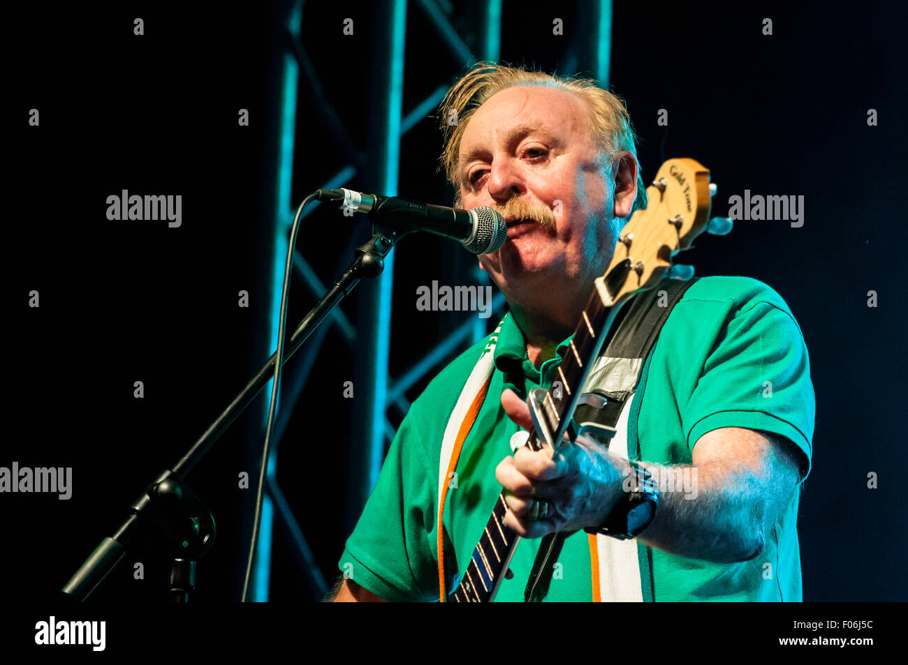 Belfast, Northern Ireland. 8 Aug 2015 - Brian Warfield from the Irish rebel band 'The Wolfe Tones' play the Feile an Phobail to an ecstatic audience. Credit:  Stephen Barnes/Alamy Live News Stock Photo