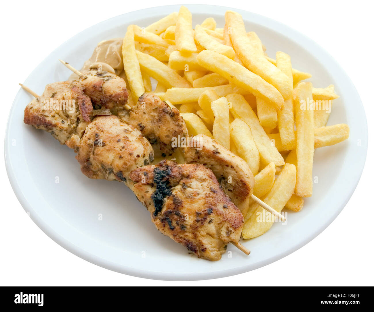 Chicken skewers with french fries Stock Photo